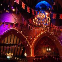 Theatre interior with glittering coloured lights and ornate decor