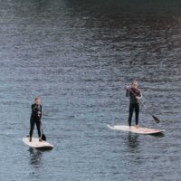 Wakeup Docklands, two paddleboarders